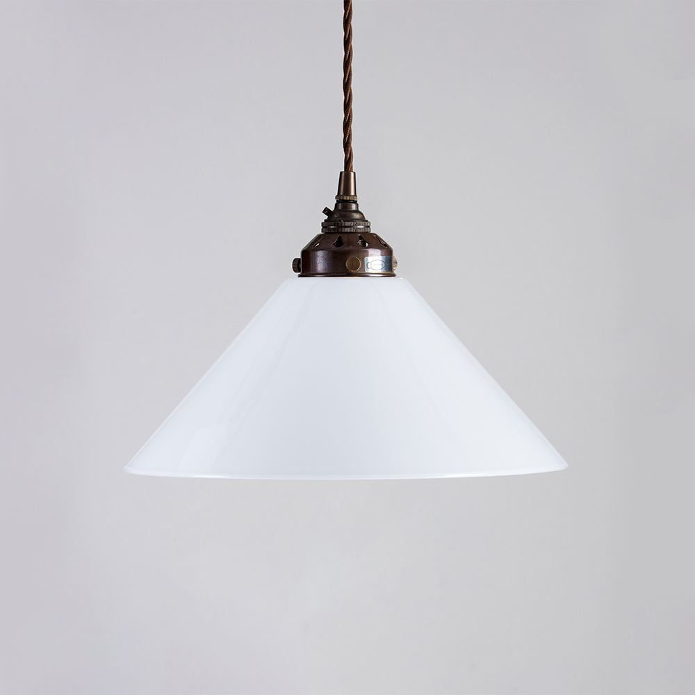 An Old School Electric Conical Opal Glass Pendant Light (B22) with a white shade hanging from it, serving as a lighting fixture.