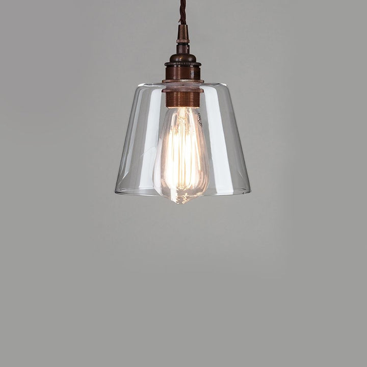 An Old School Electric Tapered Blown Glass Pendant Light with a clear glass shade.