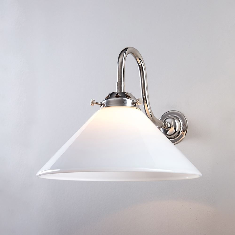 An Old School Electric Conical Glass Wall Light (B22) with a white shade mounted on a white wall.