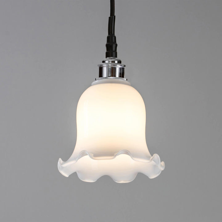 A Tulip Opal Glass Bathroom Pendant Light with a white shade, by Old School Electric.