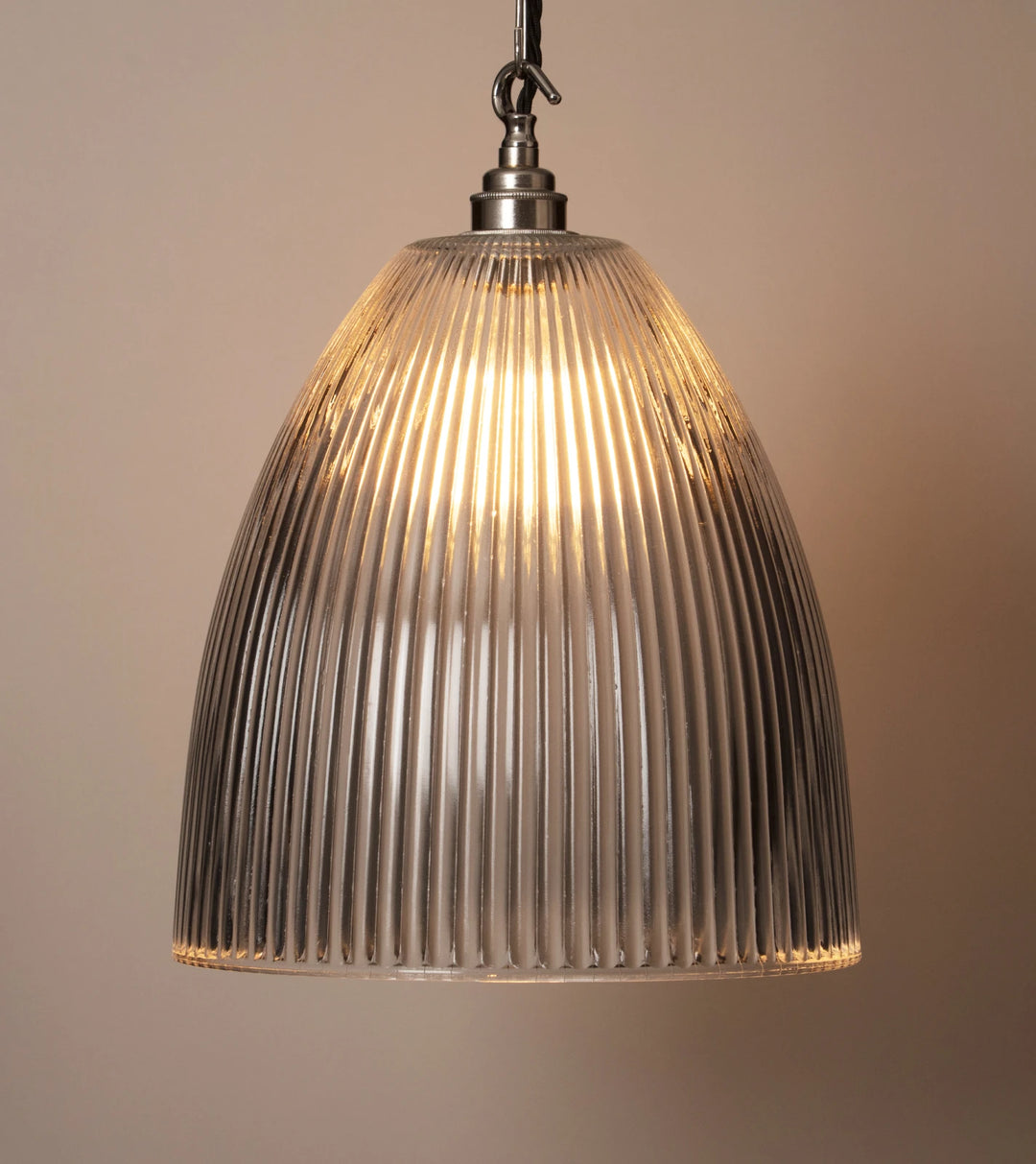 A pendant light with a grey glass shade.