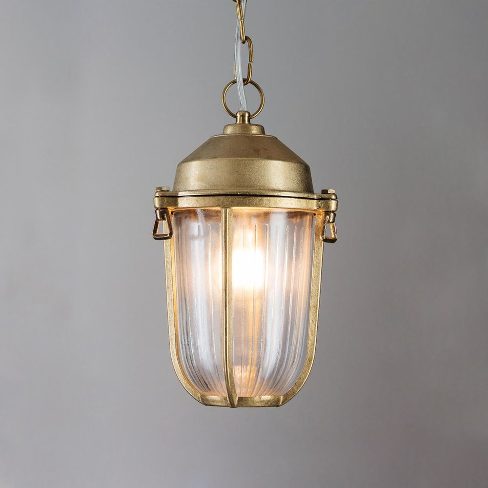 The Old School Electric Boatyard Pendant Light exudes maritime charm with its brass construction and clear glass shade, making it the perfect addition to any nautical-inspired space.