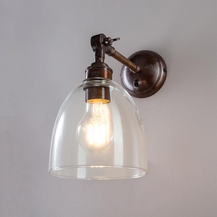 An Old School Electric Glass Adjustable Arm Wall Light, perfect for adding a touch of sophistication to any space.