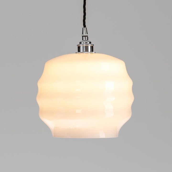 A Deco Opal Glass Pendant light fixture with a white glass shade from Old School Electric.