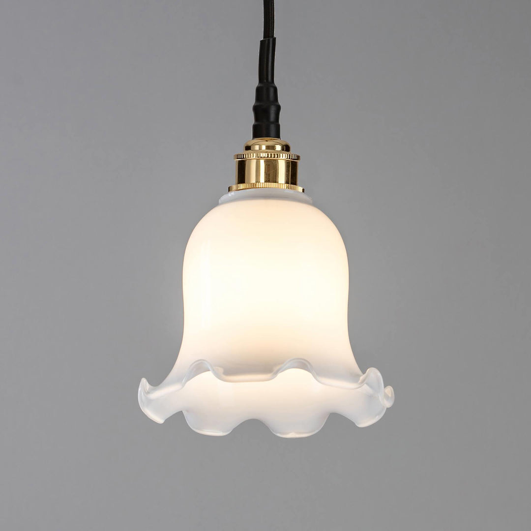 An Old School Electric Tulip Opal Glass Bathroom Pendant Light with a gold finish. This electric light fitting is an exquisite addition to any space.