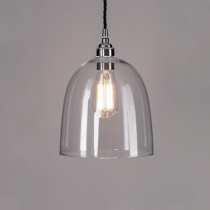 An Old School Electric Bell Blown Glass Pendant Light with a black cord for lighting fixtures.