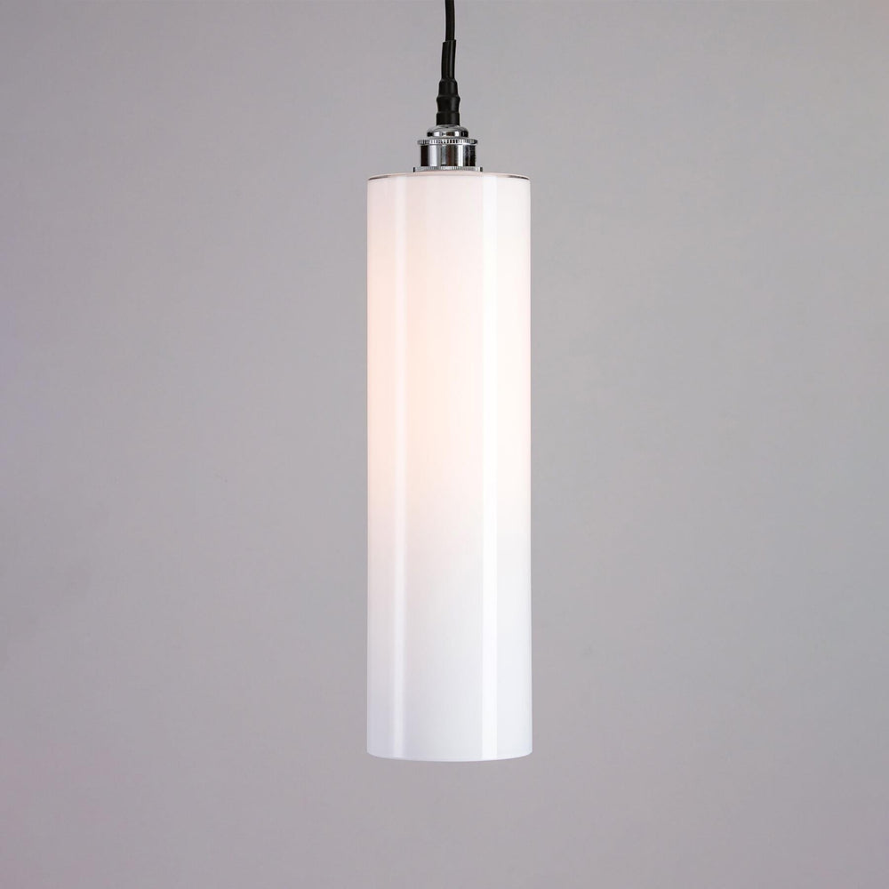 An Old School Electric Parker Bathroom Pendant Light illuminating the space with its soft glow, set against a cool gray background.