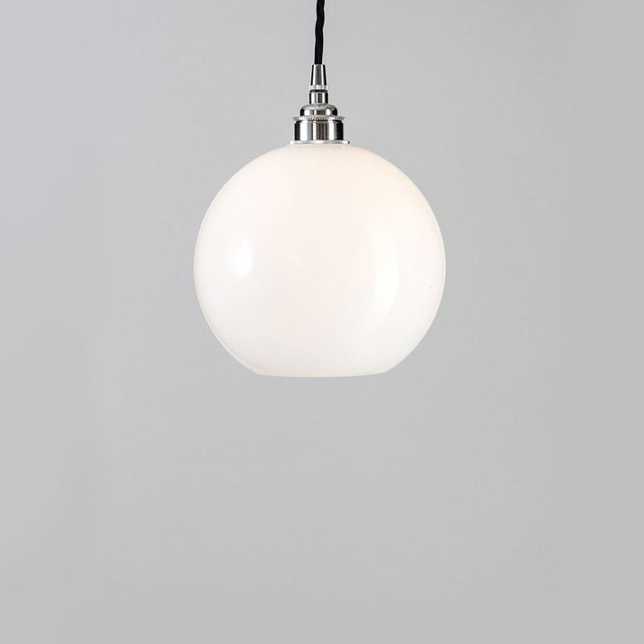 An Adderley Pendant Light from Old School Electric, a white ball pendant light hanging from a metal chain, serving as a stylish lighting fixture.