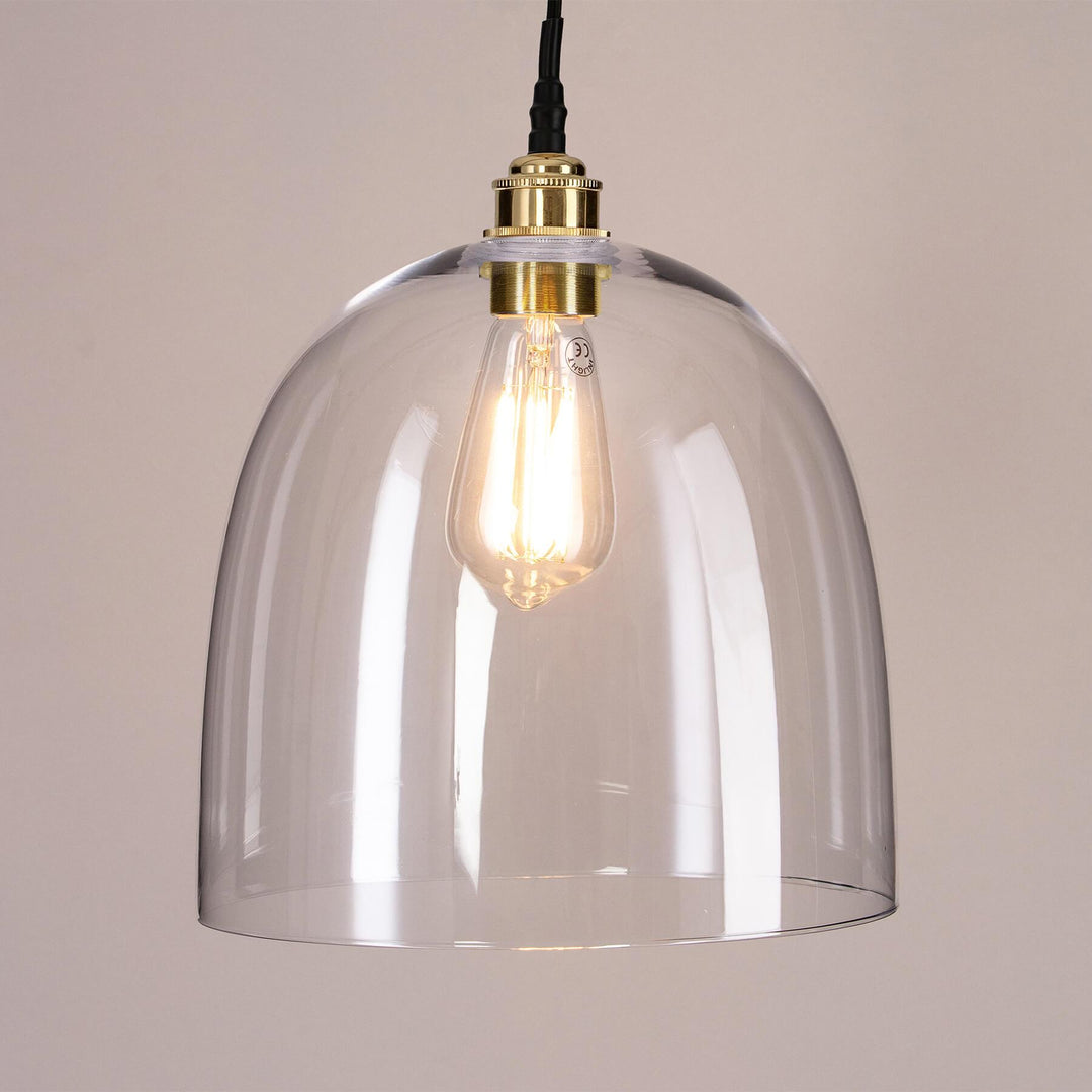 A Bell Blown Glass Bathroom Pendant Light with a gold cord that illuminates beautifully.