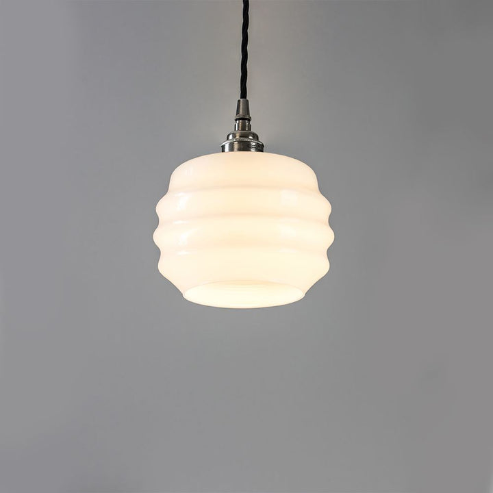 An Old School Electric Deco Opal Glass Pendant with a white shade. This elegant electric light fitting adds a touch of simplicity and sophistication to any space.