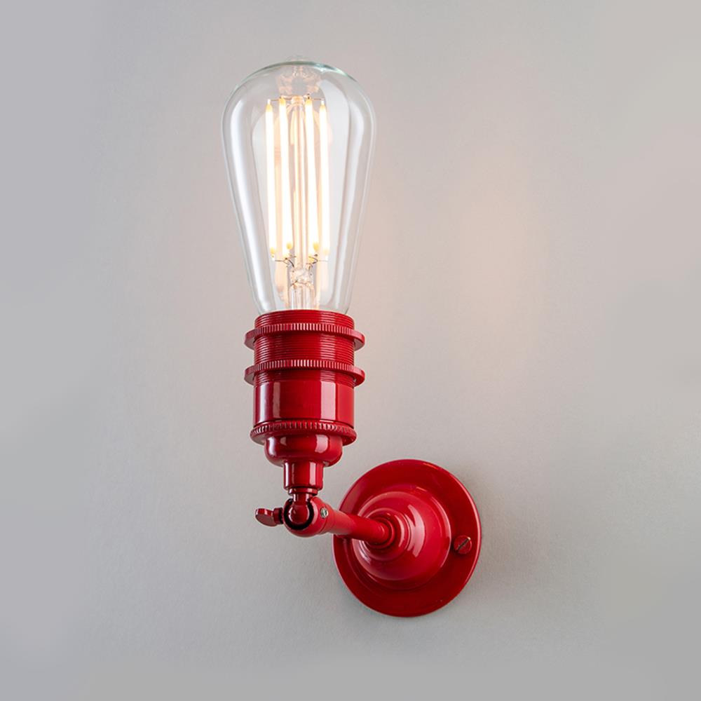 A red Industrial Wall Light with an Old School Electric glass bulb.