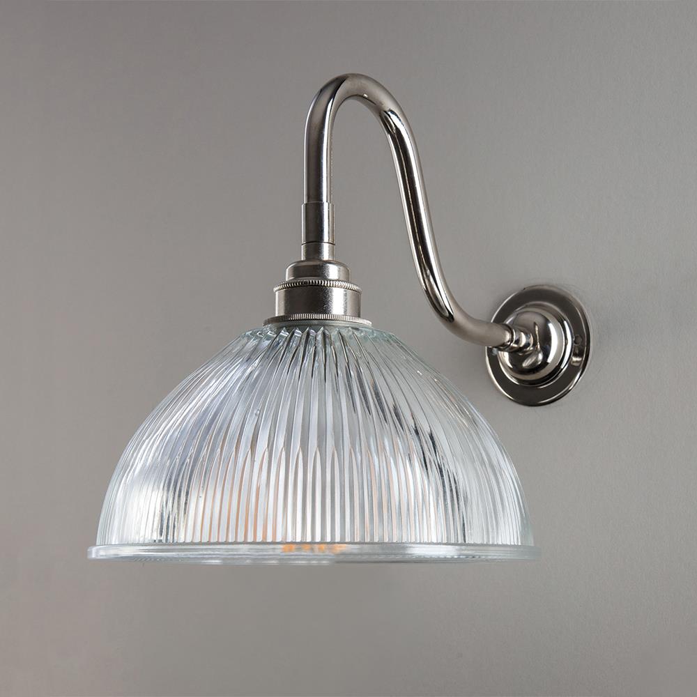 An Old School Electric Prismatic Dome Bathroom Swan Arm Wall Light with a glass shade.