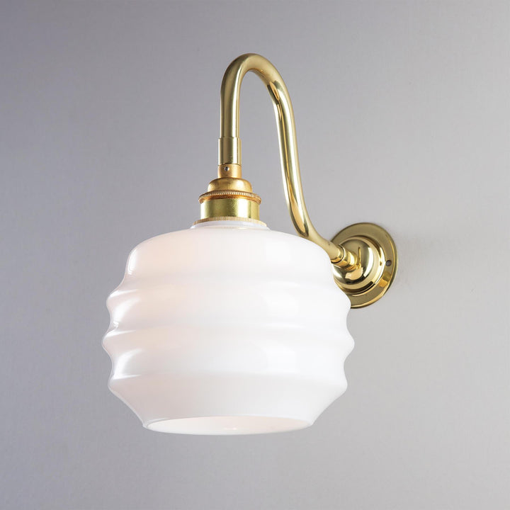 An Old School Electric Deco Opal Glass Bathroom Wall Light with a white glass shade.