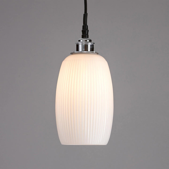 An Gillespie Bathroom Pendant Light from Old School Electric, with a white glass shade, perfect for lighting fixtures.