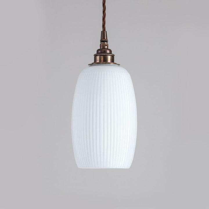 An Old School Electric Gillespie Pendant Light with a white glass shade and lighting fixture.