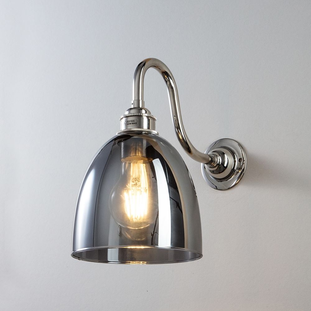 An Old School Electric Glass Swan Arm Smoked Glass Wall Light fixture with a glass shade.