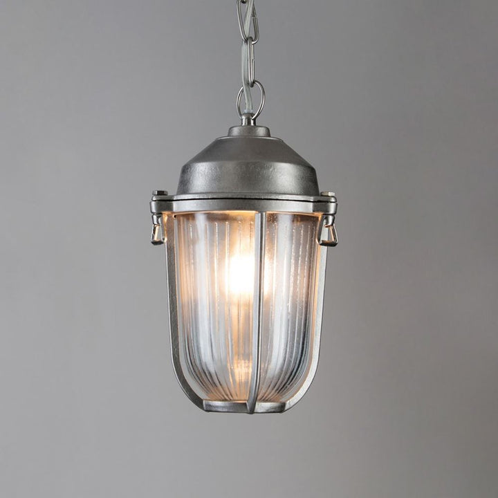 Add maritime charm to your outdoor space with the Old School Electric Boatyard Pendant Light. This hanging light features a clear glass shade that beautifully illuminates any area, providing nautical inspiration.