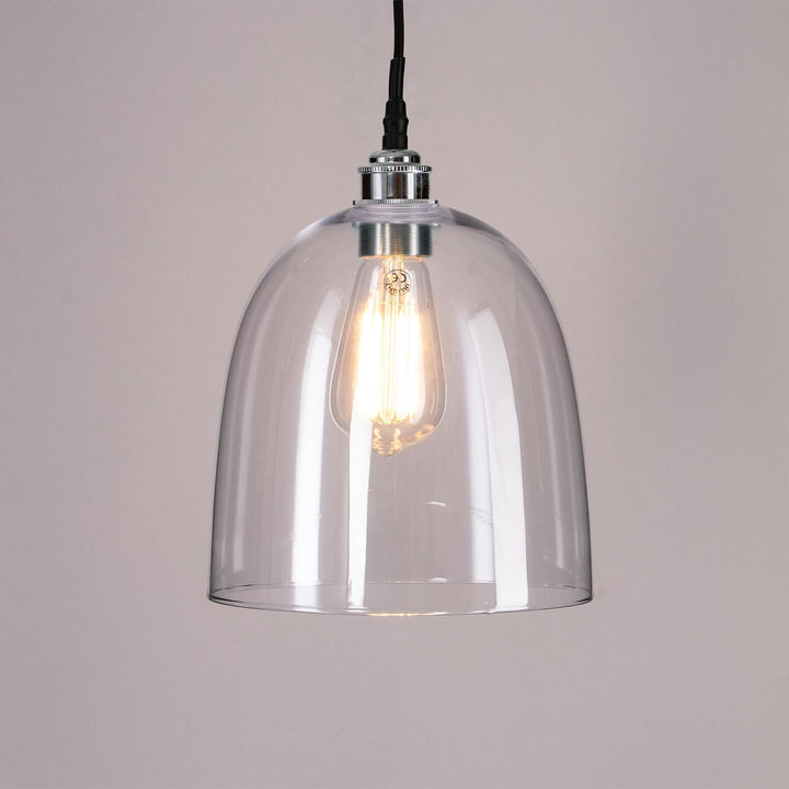 An Old School Electric Bell Blown Glass Bathroom Pendant Light with a black cord, perfect for adding elegant illumination to any bathroom.
