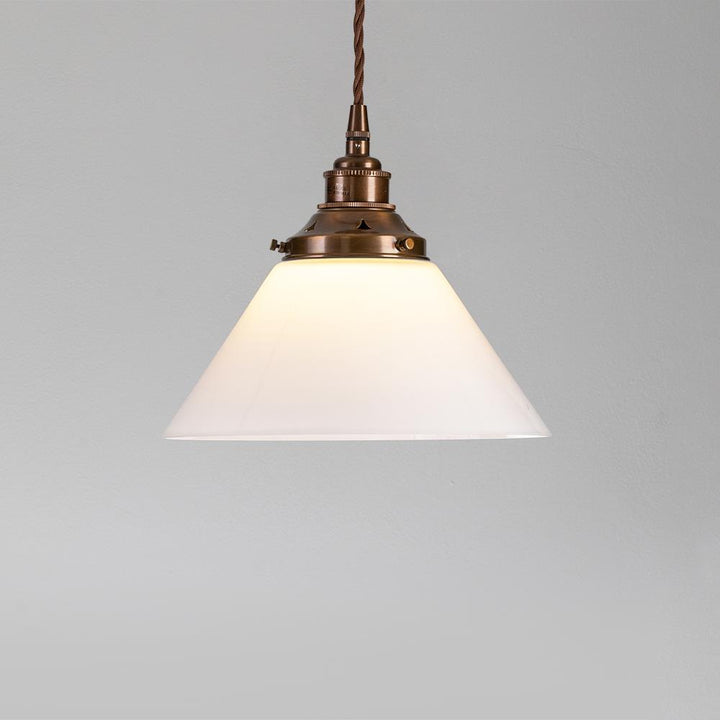 A small Conical Opal Glass Pendant Light from Old School Electric, perfect for adding electric lights and enhancing the ambiance of any space.