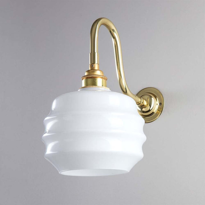 A white Deco Opal Glass Wall Light with a brass finish, perfect for Old School Electric lighting.