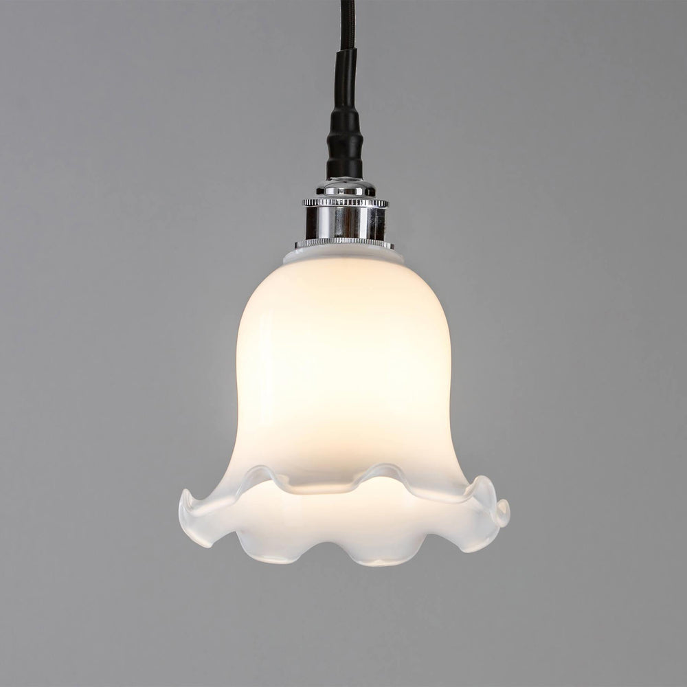 A Tulip Opal Glass Bathroom Pendant Light with a white shade, by Old School Electric.