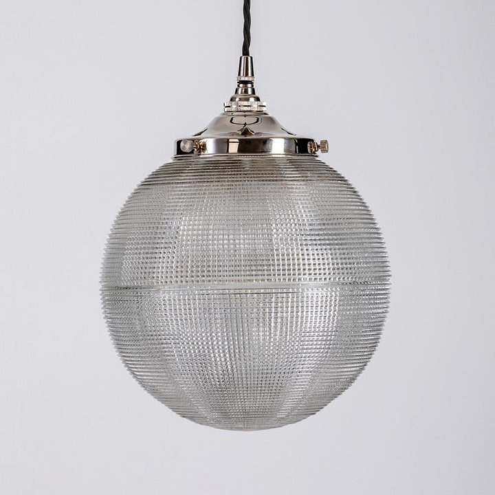 An Old School Electric Prismatic Globe Pendant Light with a metal frame.