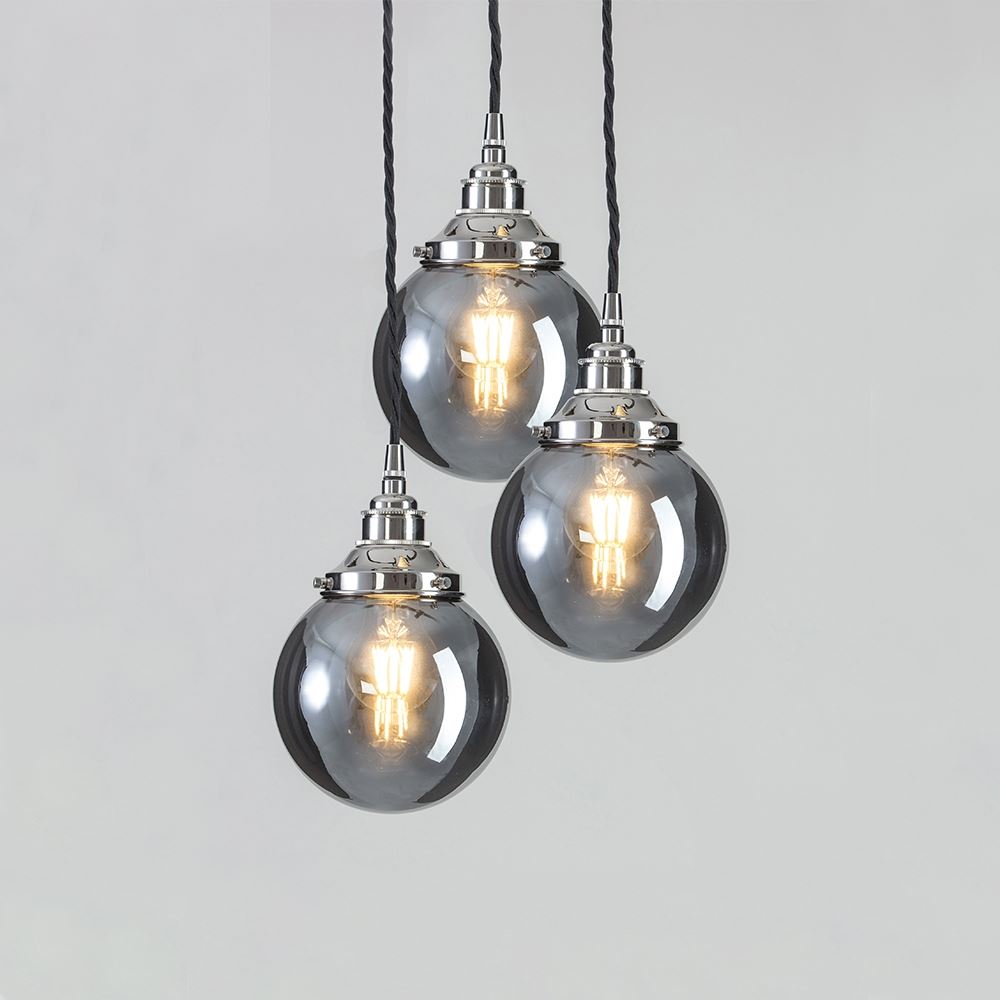 Three Blown Smoked Glass Cluster Pendant Lights by Old School Electric hanging from a chain.