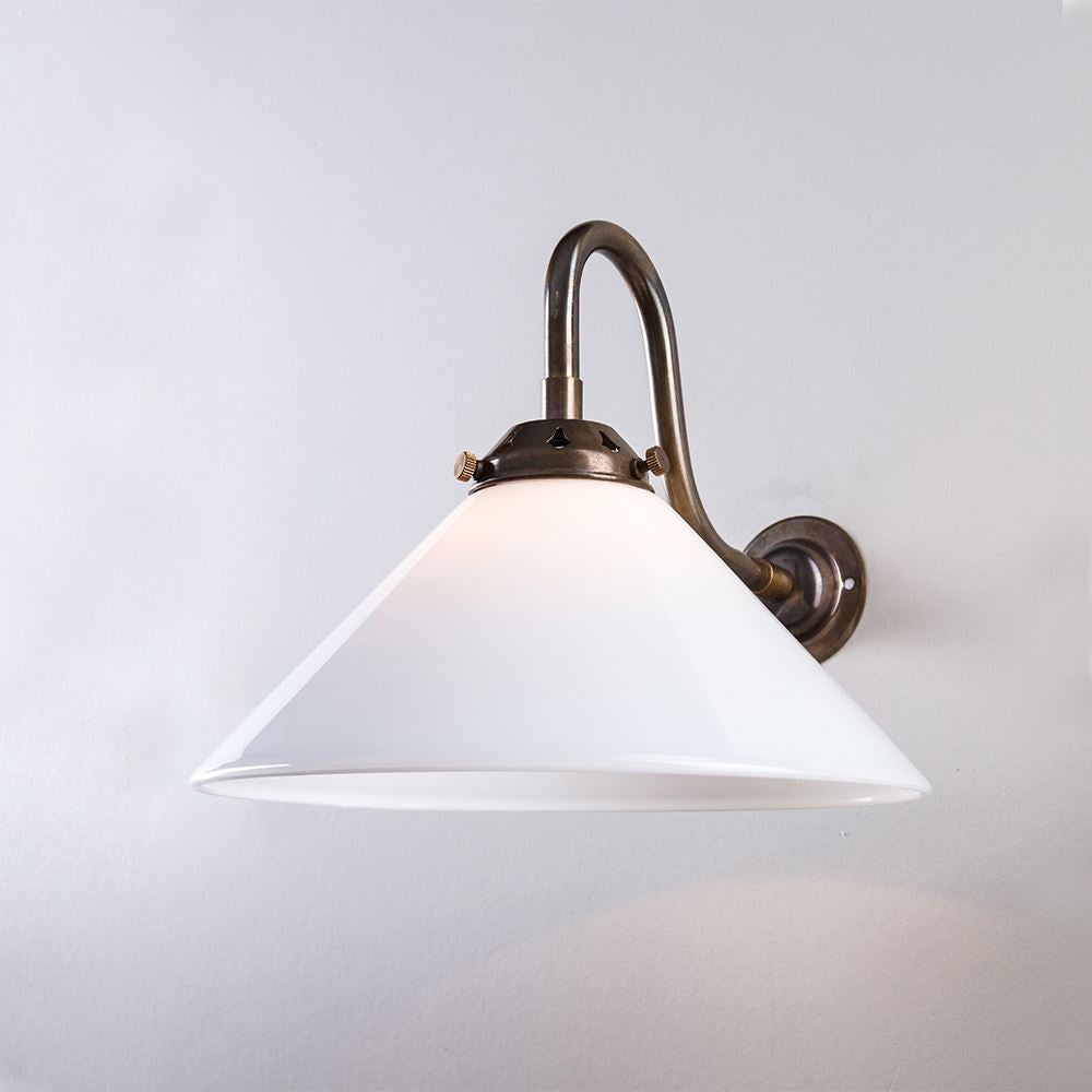An Old School Electric Conical Glass Wall Light (B22) with a white shade, providing electric lighting.
