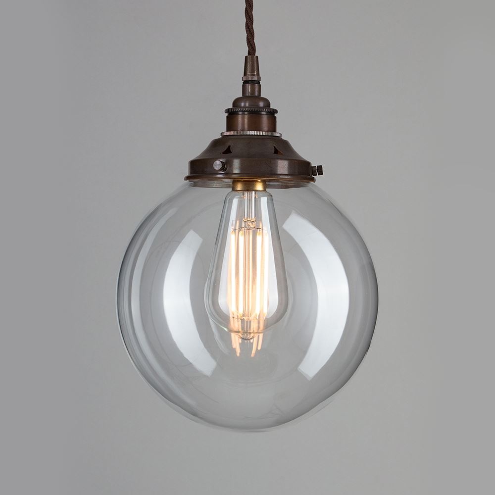 An Old School Electric Globe Blown Glass Pendant Light with a metal chain is a stylish lighting fixture that provides bright electric lights.