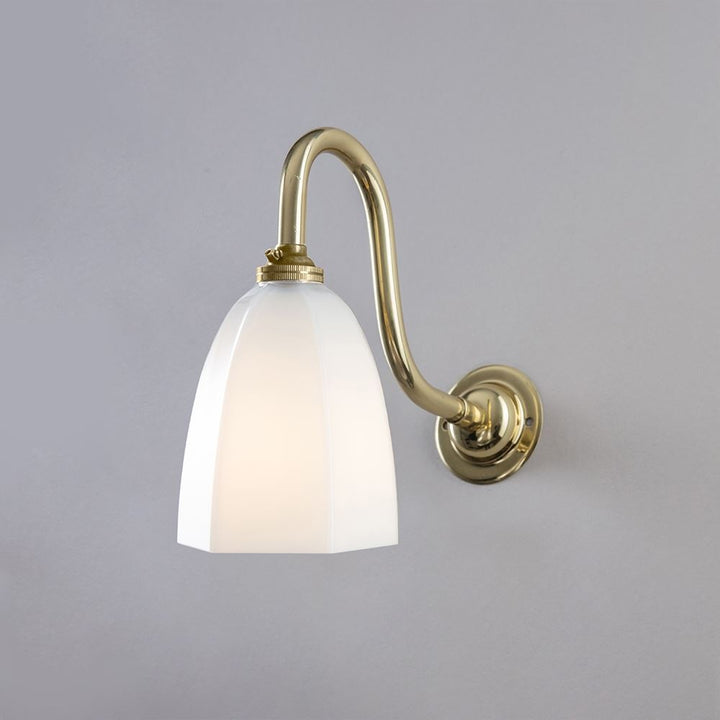 An Old School Electric Hexagon Swan Wall Light (B22) with a white glass shade.