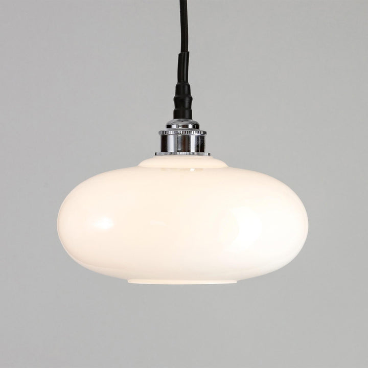 An Old School Electric Montgomery Bathroom Pendant Light with a black cord, perfect for lighting fixtures.