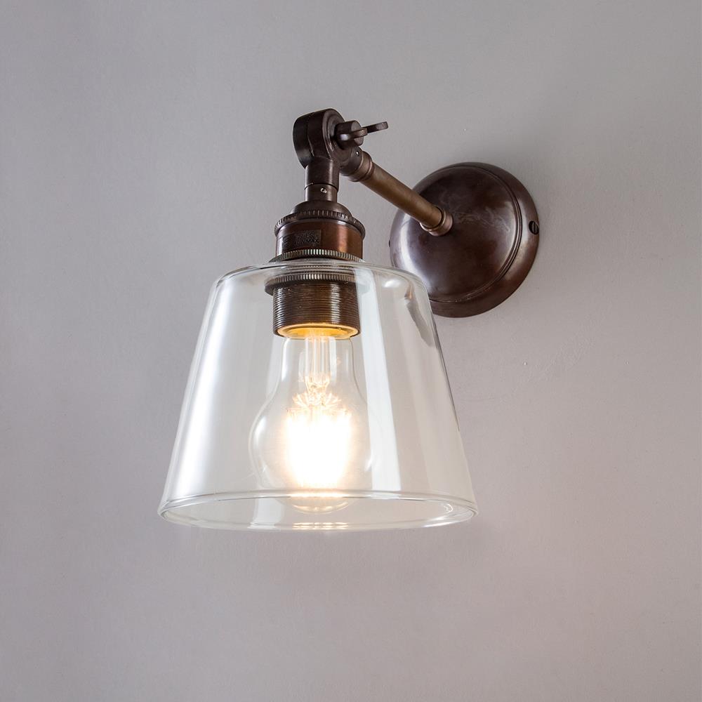 An Old School Electric Glass Adjustable Arm Wall Light with an electric glass shade.