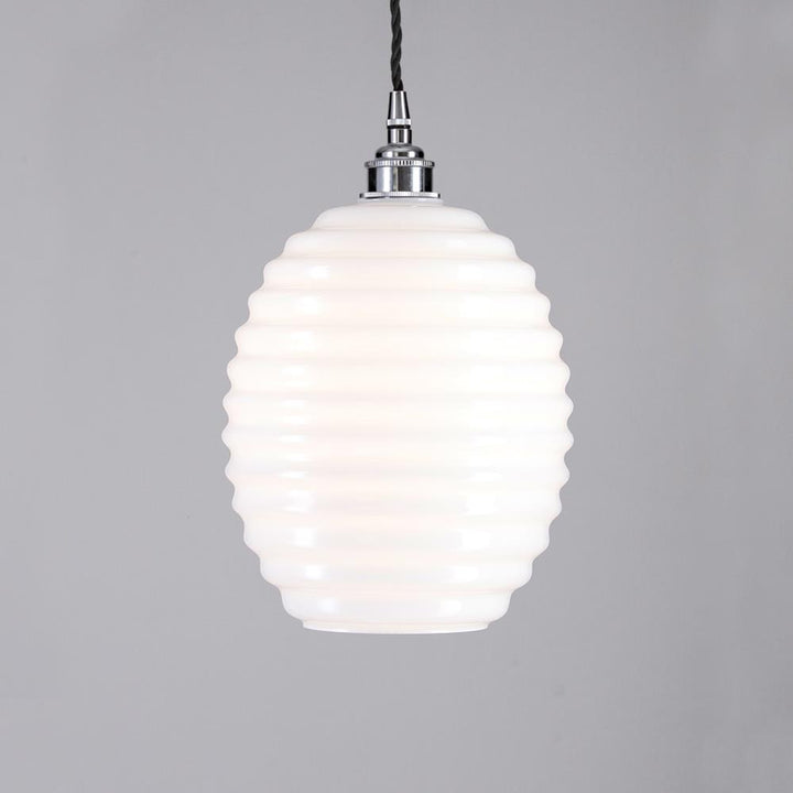 An Old School Electric Beehive Pendant Light with a white glass shade.