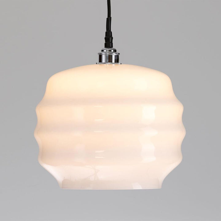 A Deco Bathroom Pendant Light by Old School Electric with a white glass shade.