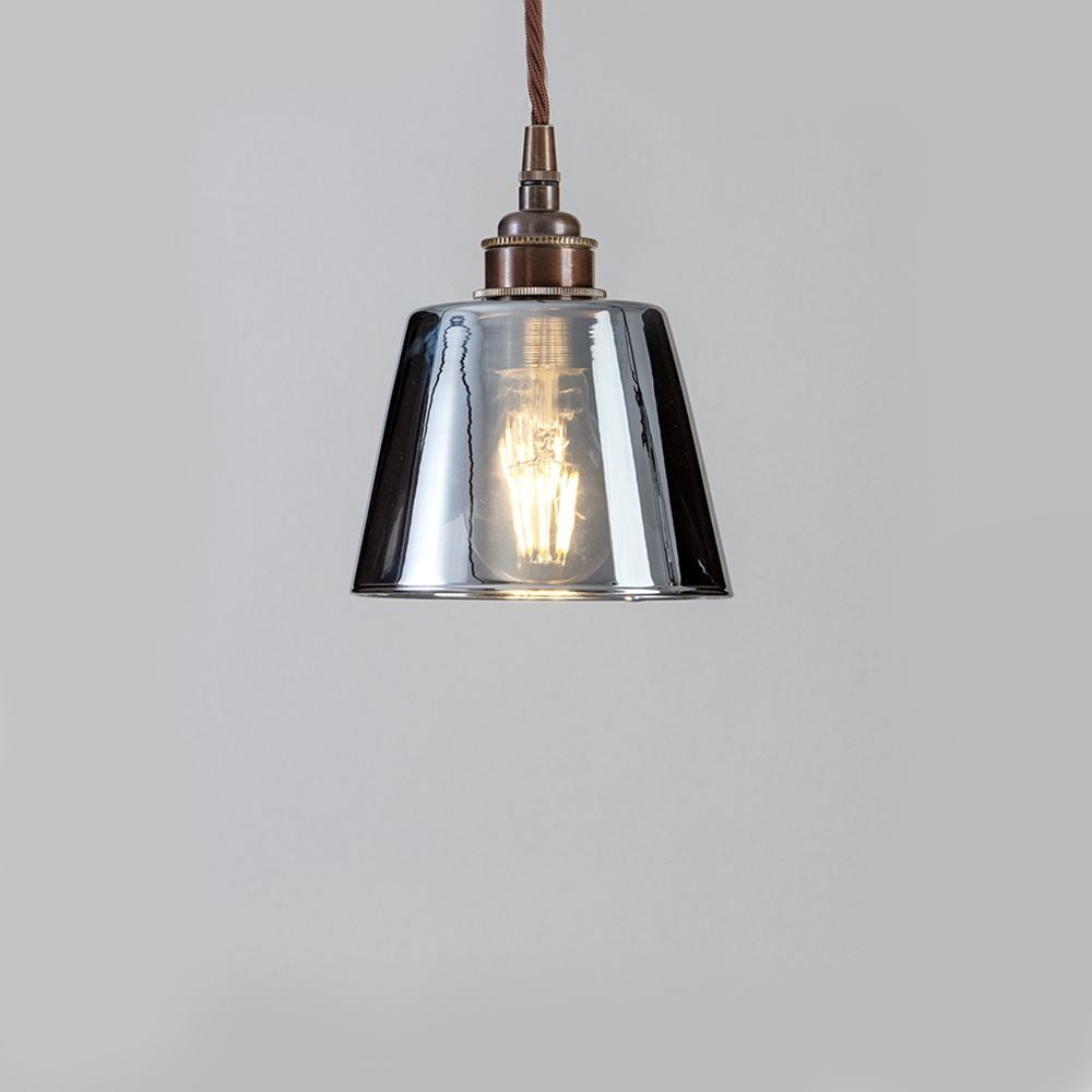 An Old School Electric Tapered Blown Smoked Glass Pendant Light with a brown cord.