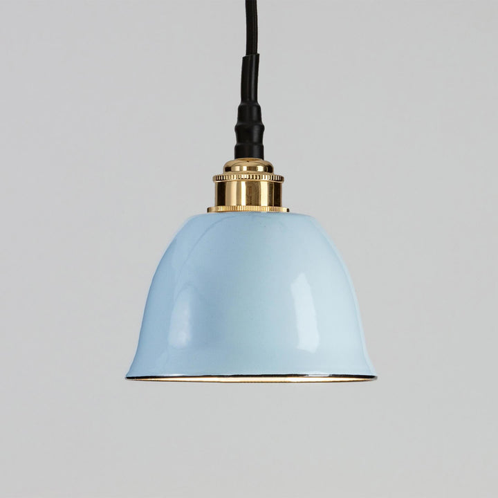 An Old School Electric lighting fixture with a blue shade and brass hardware, such as the Maison Bathroom Pendant Light.