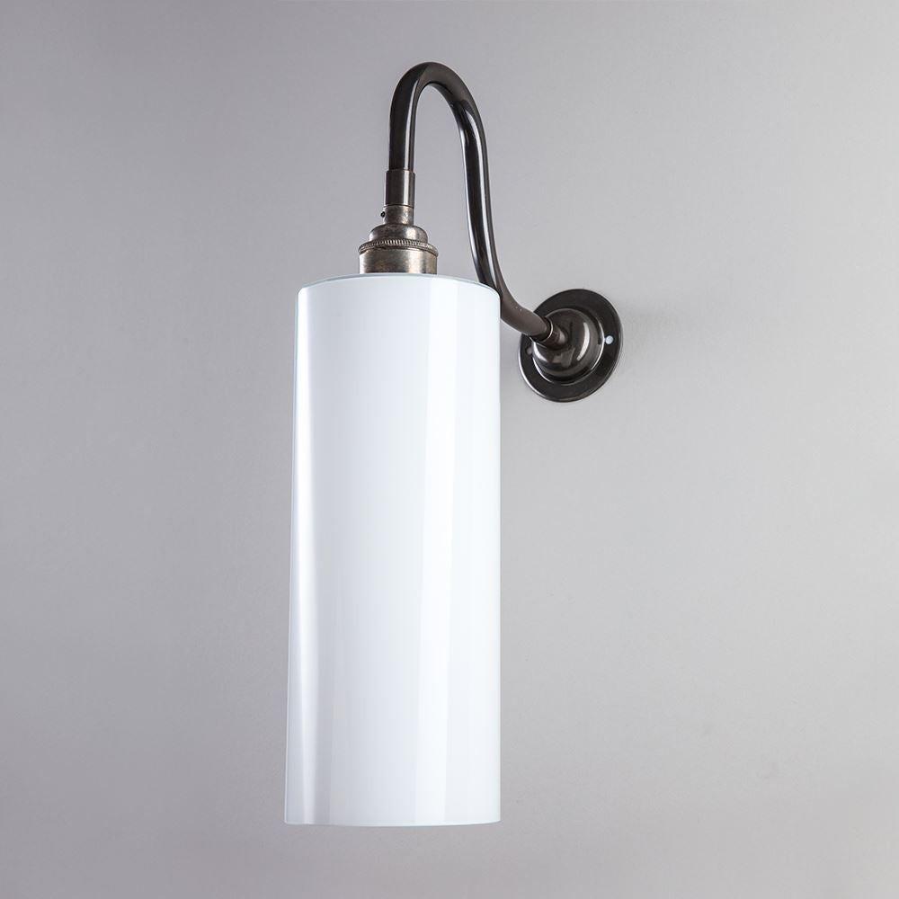 An Old School Electric Parker Wall Light with a black shade, serving as an electric light fitting, on a white wall.