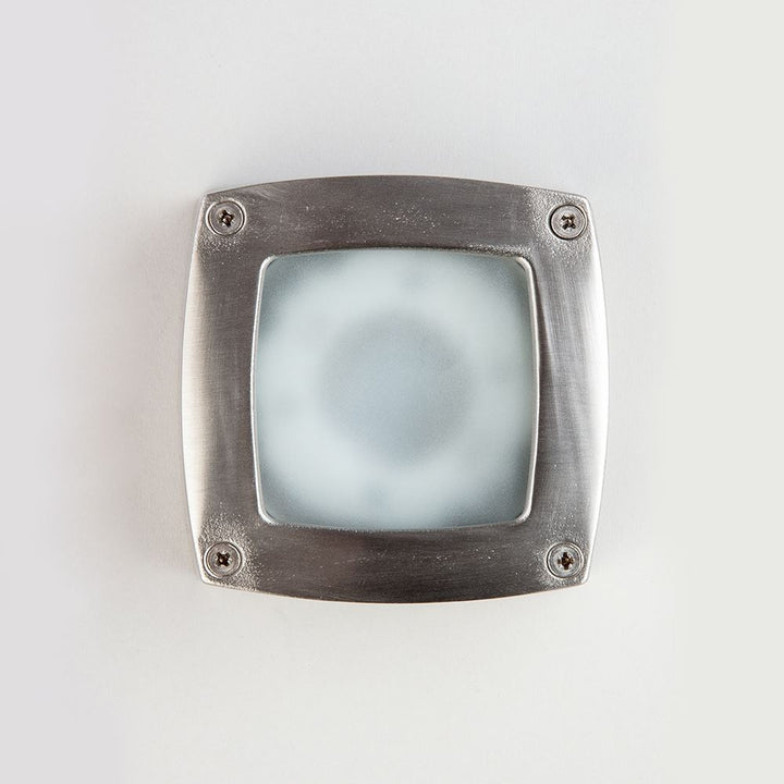 An Old School Electric Square Outdoor Path Light on a white surface, serving as an electric light.