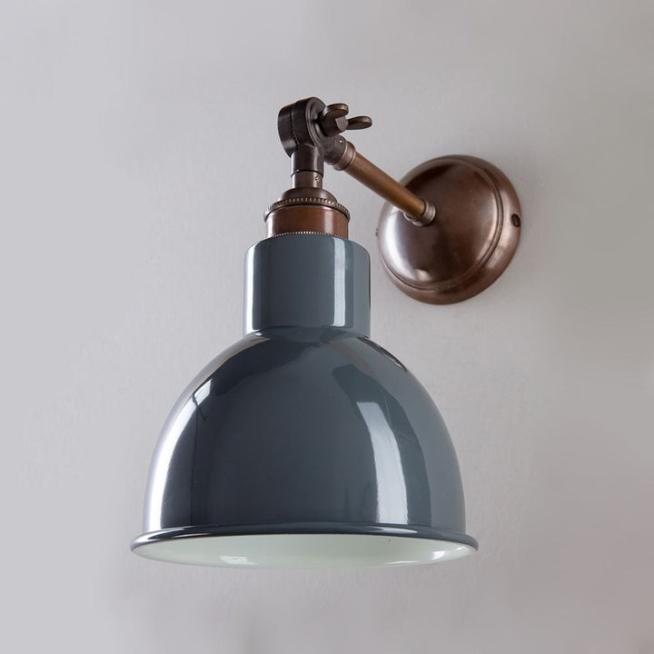 An Old School Electric Churchill Coloured Shades Wall Light with a blue shade.