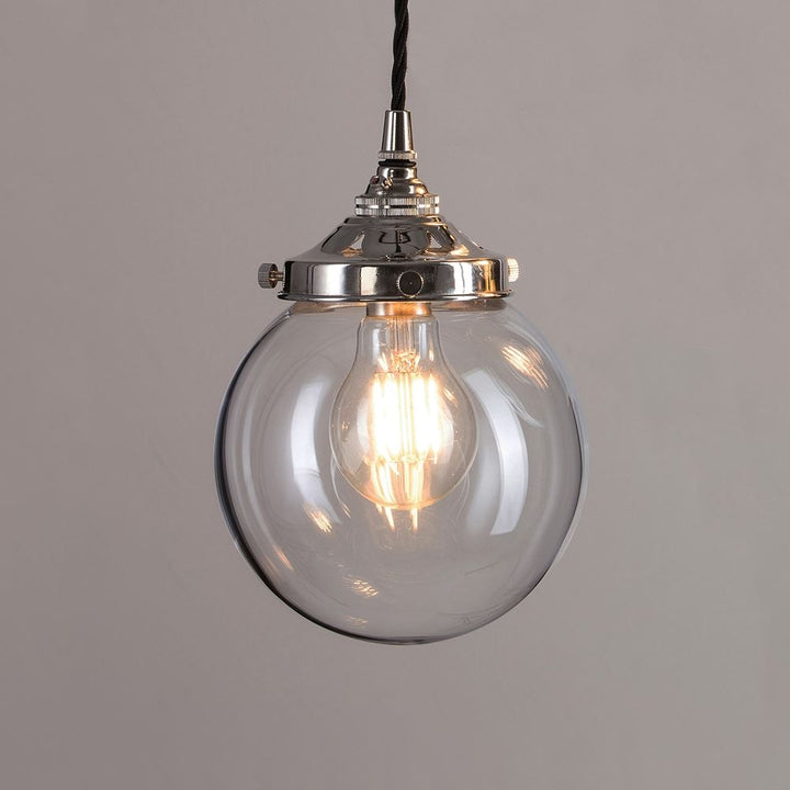 An elegant Globe Blown Glass Pendant Light (B22) fitting, with a clear glass globe and a sturdy metal chain from Old School Electric.