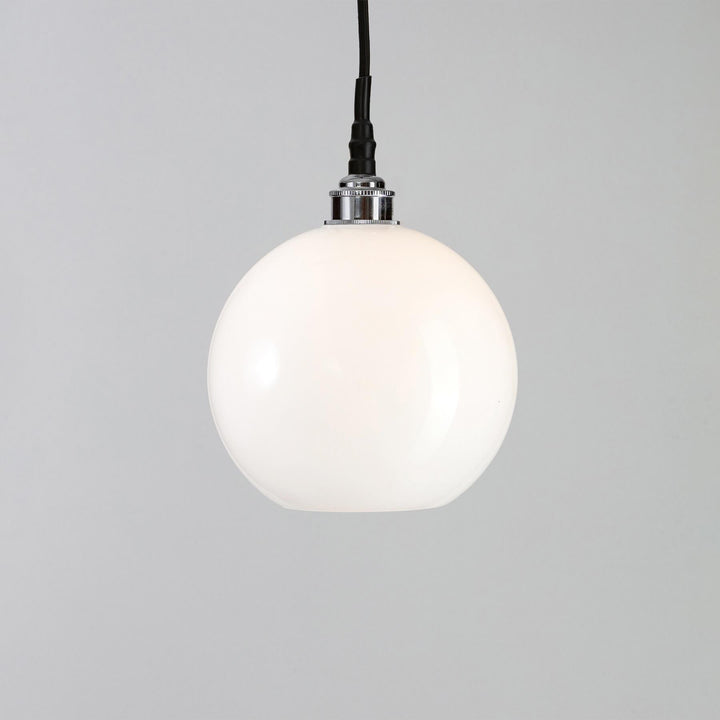 An Adderley Bathroom Pendant Light fitting hanging from an Old School Electric black cord.