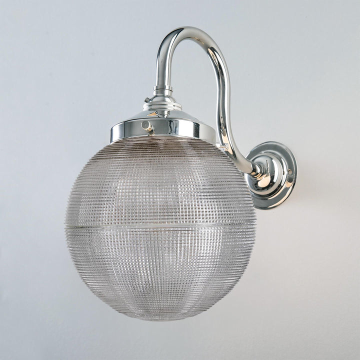An Old School Electric Prismatic Globe Wall Light that provides ambient lighting.