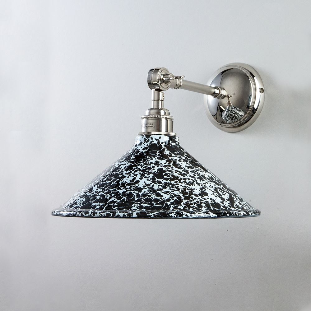 An Old School Electric Splatter Wear Shade Adjustable Arm Wall Light, an electric light fitting, on a white wall.