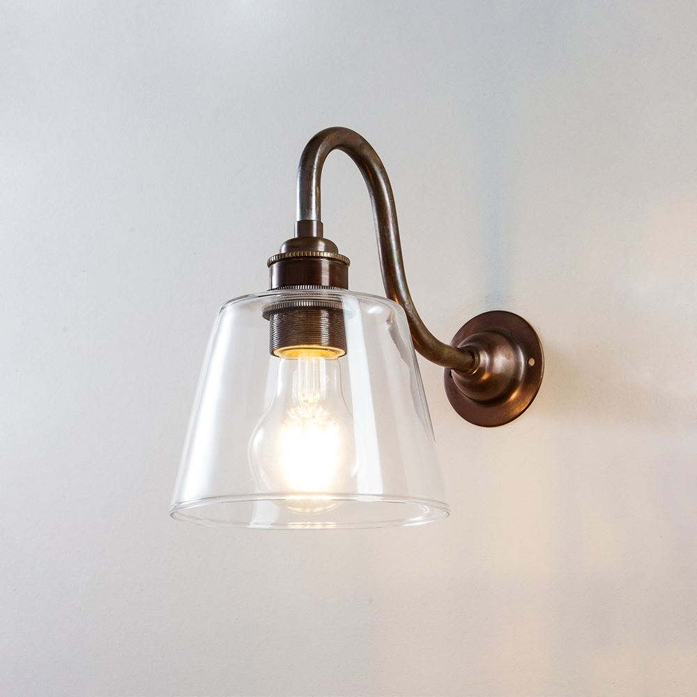 An Old School Electric Glass Swan Arm Wall Light featuring a glass shade.