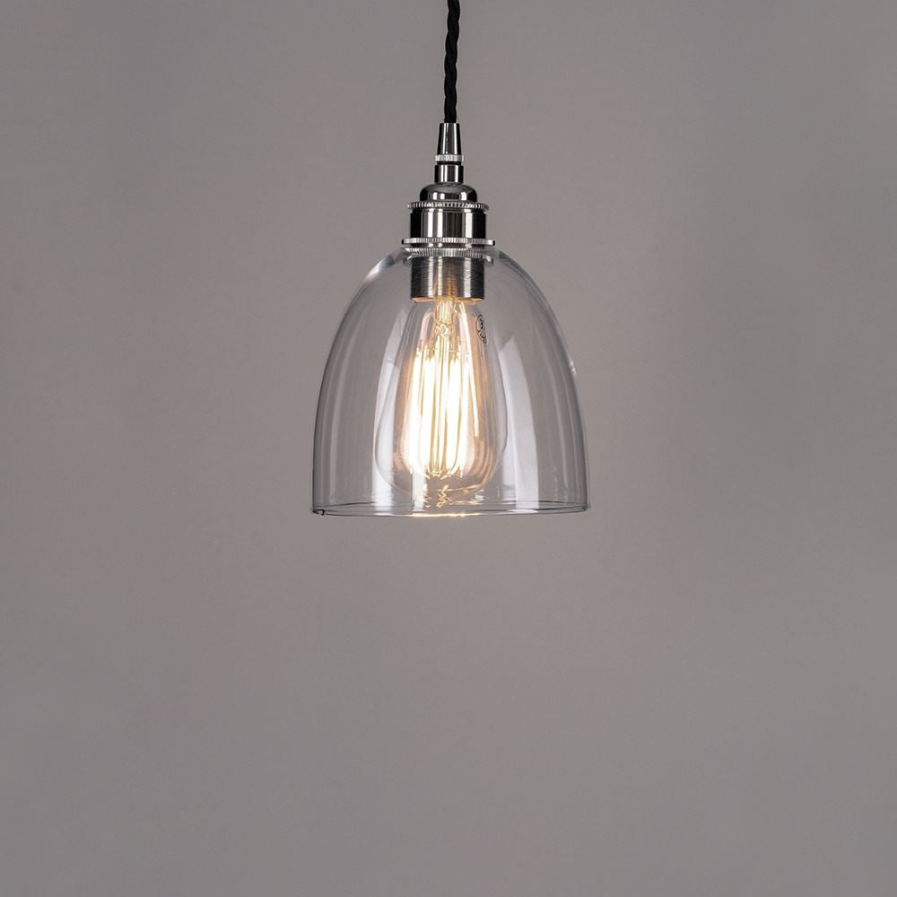 A Bell Blown Glass Pendant Light with a black cord, created by Old School Electric, is a sleek lighting fixture that adds elegance and brightness to any space.
