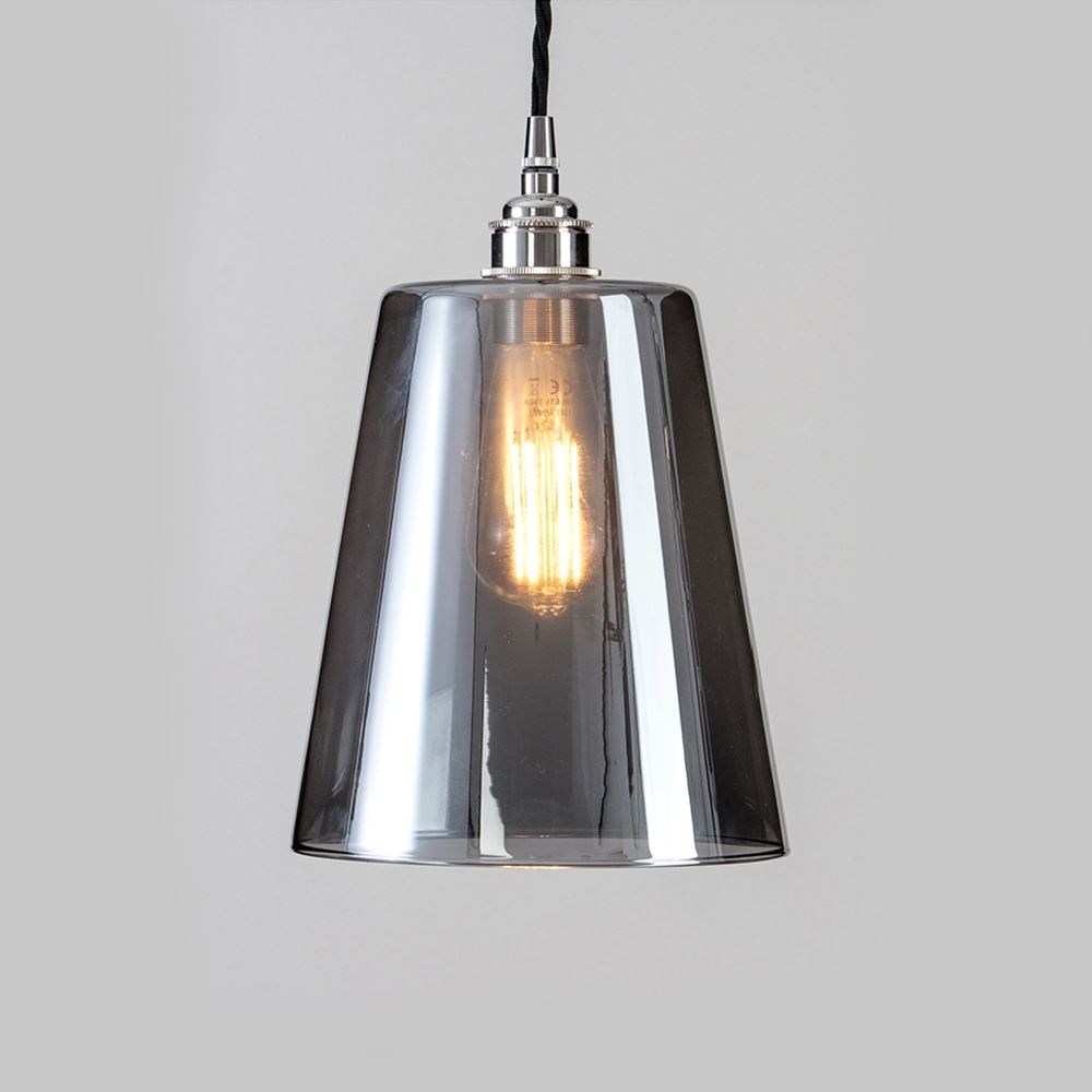 An Old School Electric Tapered Blown Smoked Glass Pendant Light fixture with a light bulb.