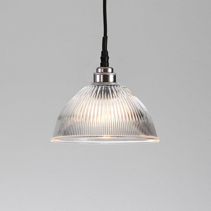 A Prismatic Dome Bathroom Pendant Light from Old School Electric is a stunning lighting fixture that adds elegance and sophistication to any space. The clear glass dome allows for ample light distribution, creating a warm and inviting ambiance. Whether