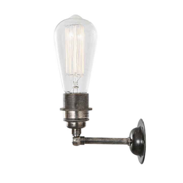 An Old School Electric Industrial Wall Light with a glass bulb.