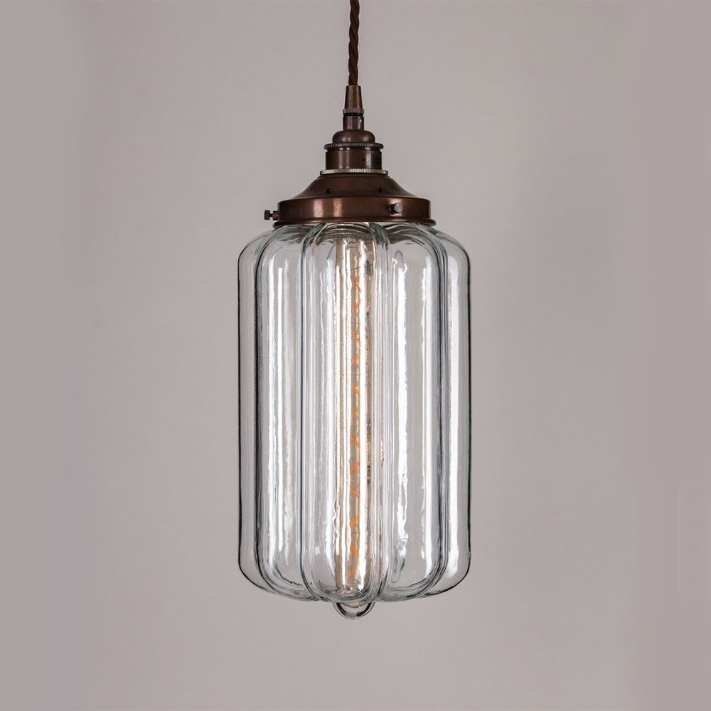 An Ellington Pendant Light by Old School Electric with a brass finish is a stunning addition to any space. This exquisite light fitting seamlessly combines elegance and functionality, bringing warmth and style to your room. The glass material creates a beautiful lighting effect.