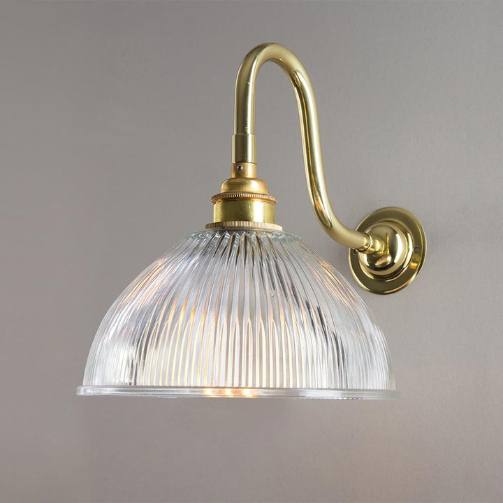 An Old School Electric Prismatic Dome Bathroom Swan Arm Wall Light with a clear glass shade is a stunning lighting fixture.